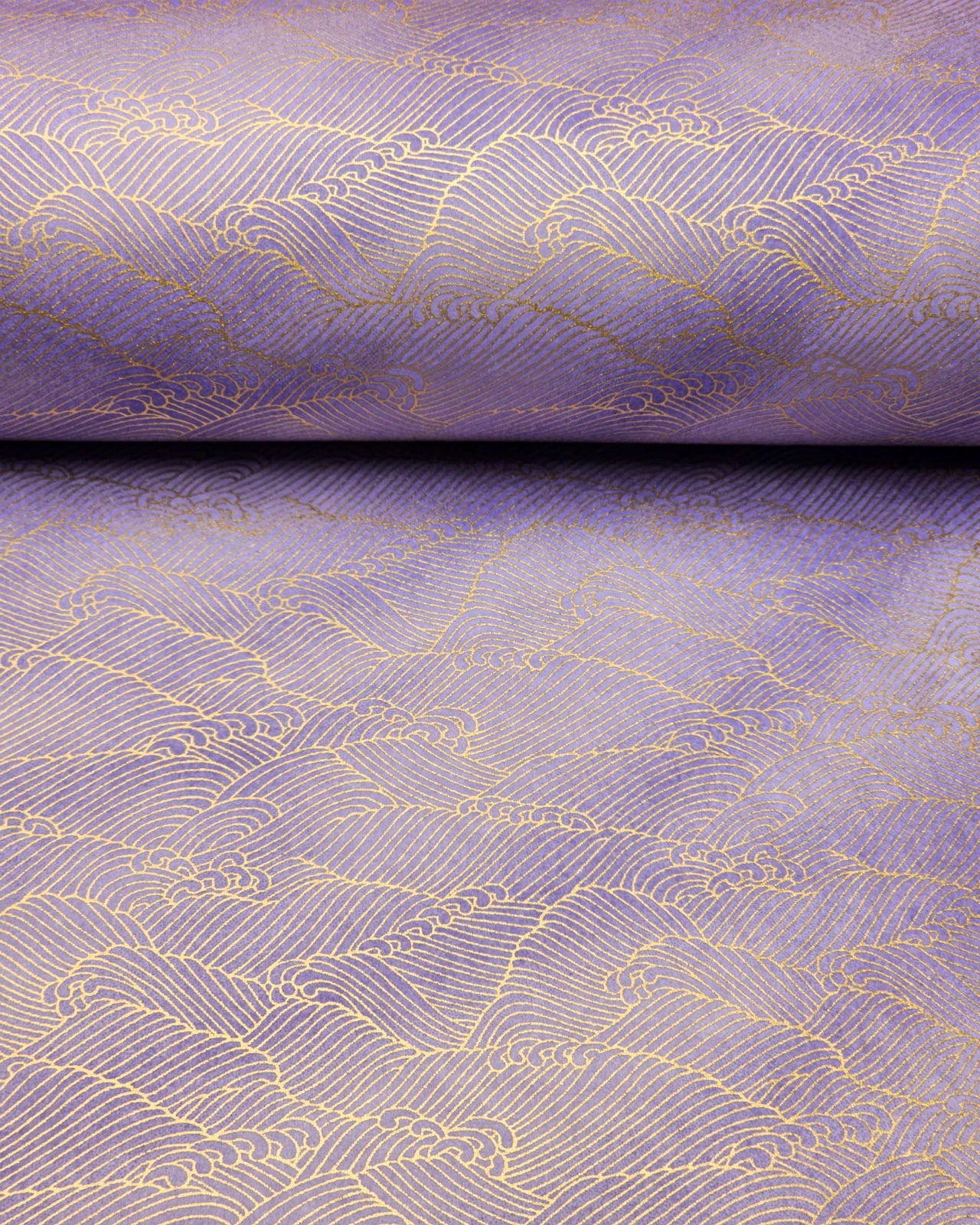 Japanese chiyogami paper featuring small metallic gold waves (aranami) on a gradient purple background.