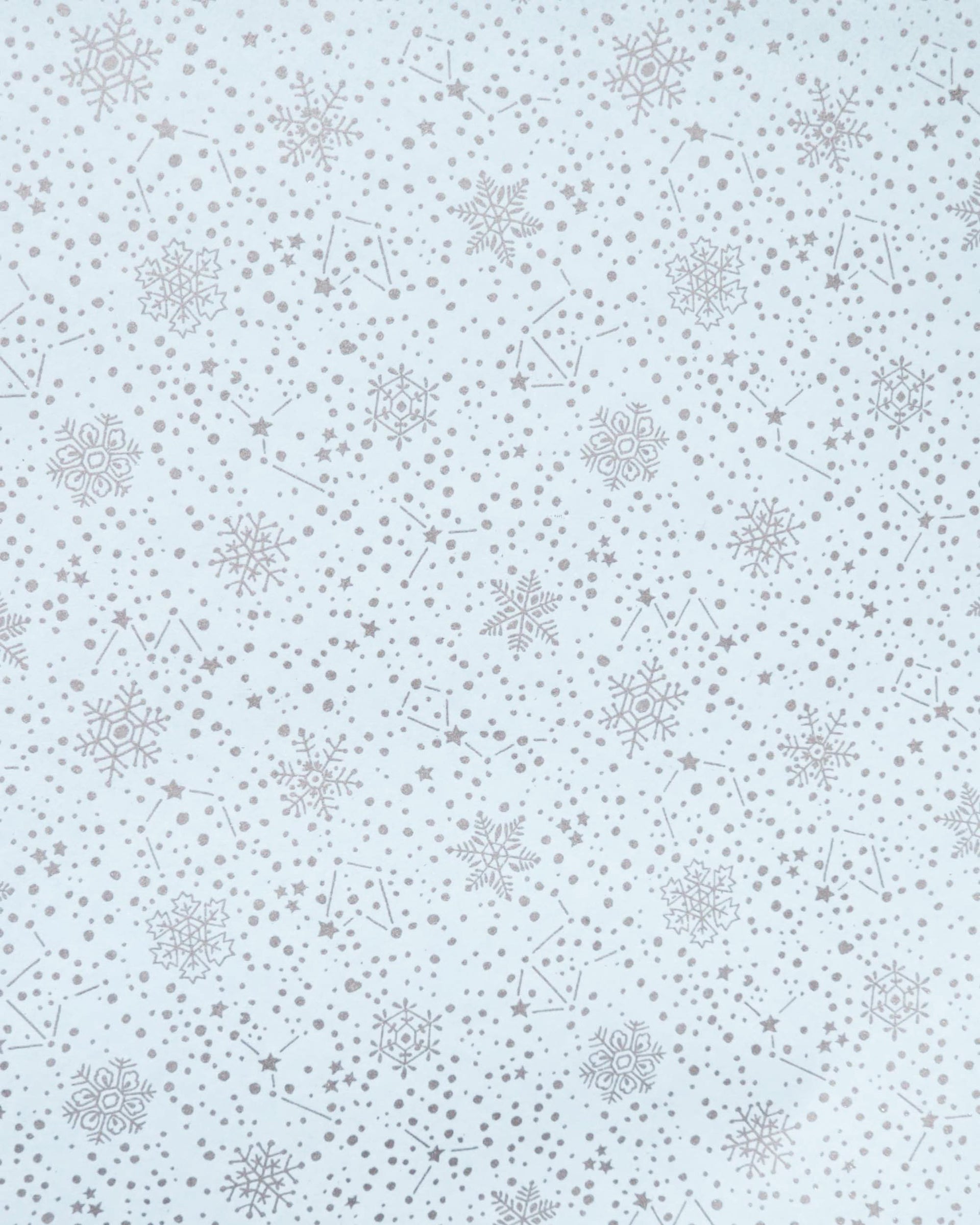 Japanese chiyogami paper featuring assorted metallic silver snowflakes and star constellations on a light blue background.