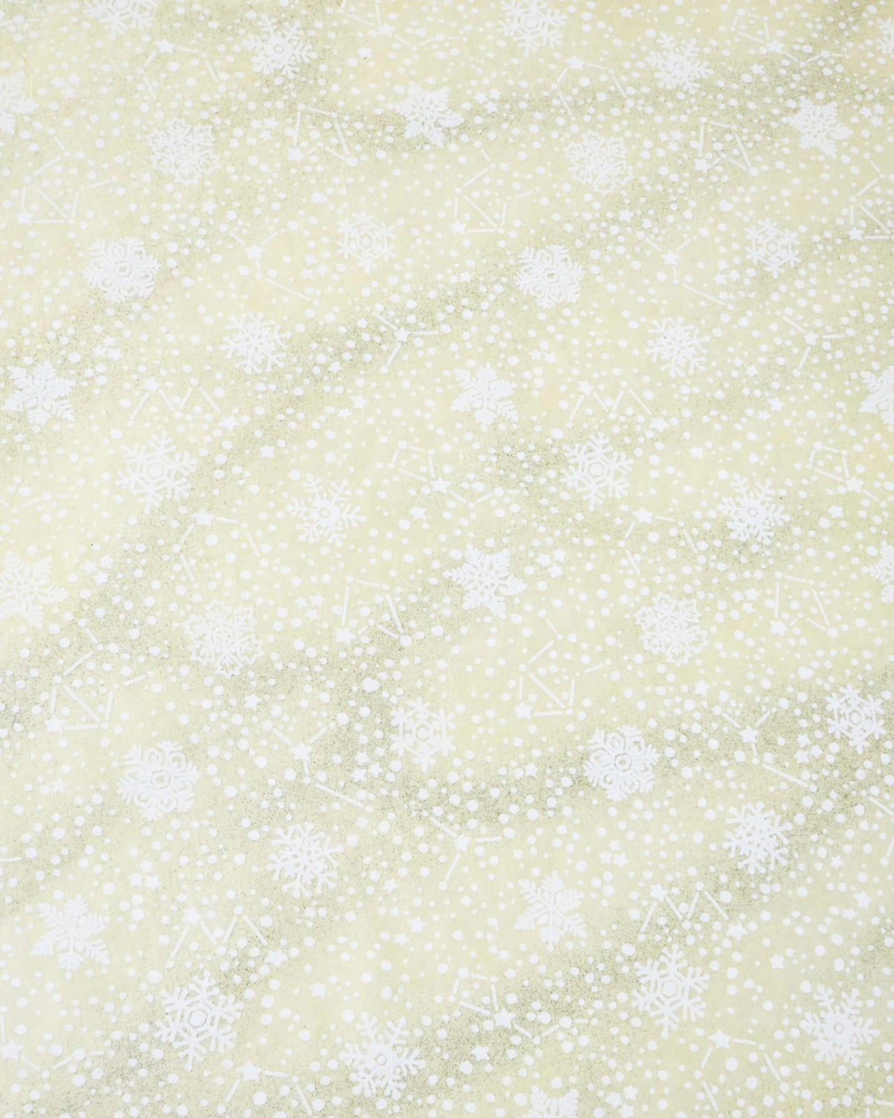 Japanese chiyogami paper featuring assorted white snowflakes and star constellations on a pearlescent light yellow background with metallic silver glitter details.