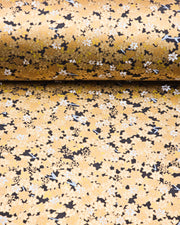 Japanese chiyogami paper featuring small gold and white momiji (maple leaves) on a black background with metallic gold details.