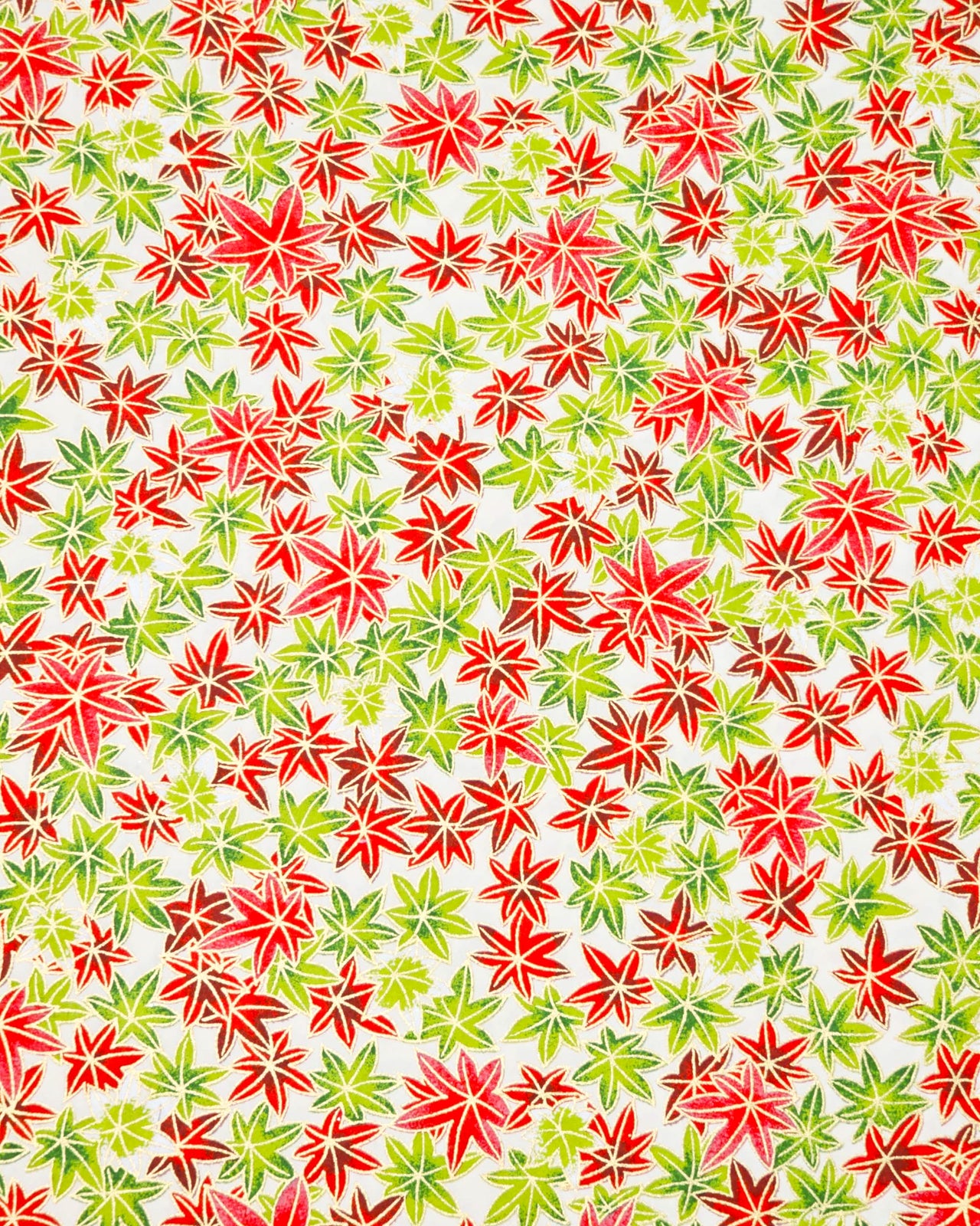 Japanese chiyogami paper featuring red, green, and white momiji (maples leaves) on a white background with metallic gold details.