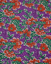 Japanese chiyogami paper featuring red and white flowers with green, cream, and white leaves on a dark purple background in a mosaic-inspired design.
