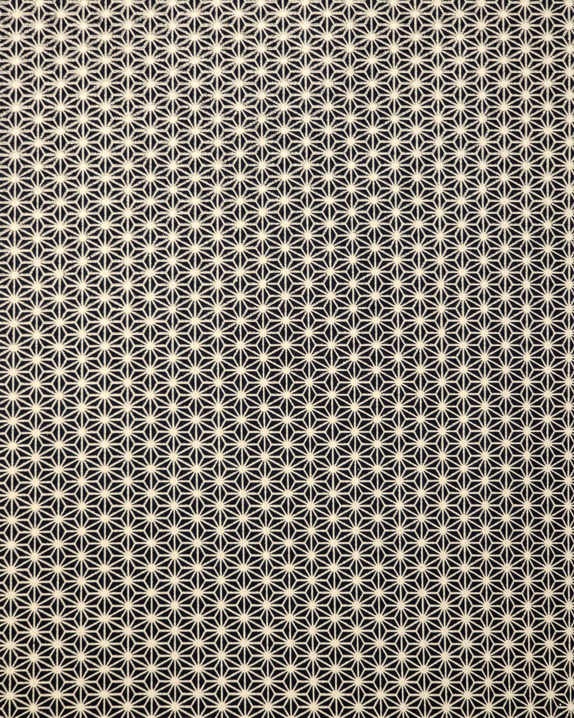 Japanese chiyogami paper featuring a small traditional gold asanoha (hemp leaf) pattern on a black background.