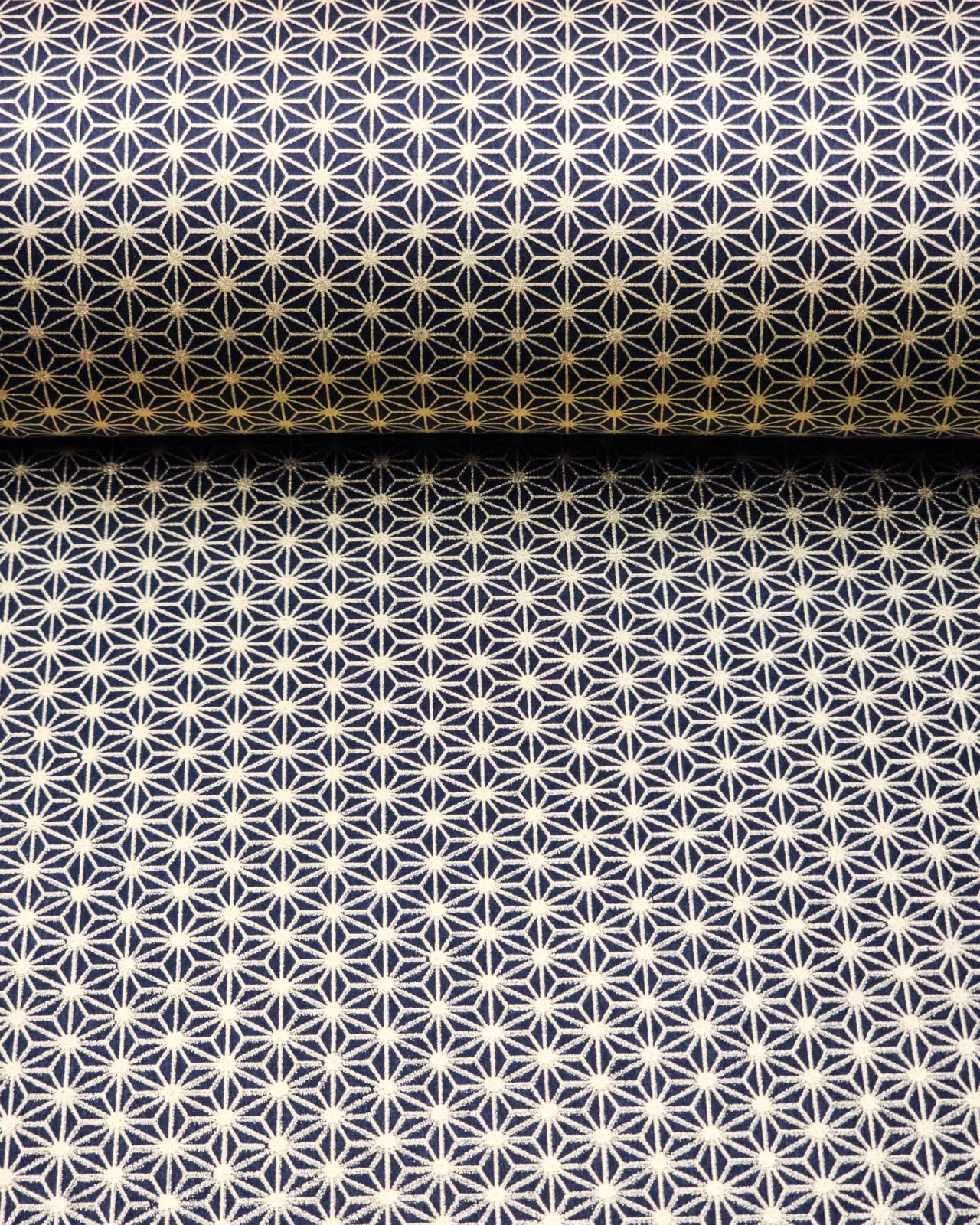 Japanese chiyogami paper featuring a small traditional gold asanoha (hemp leaf) pattern on a black background.