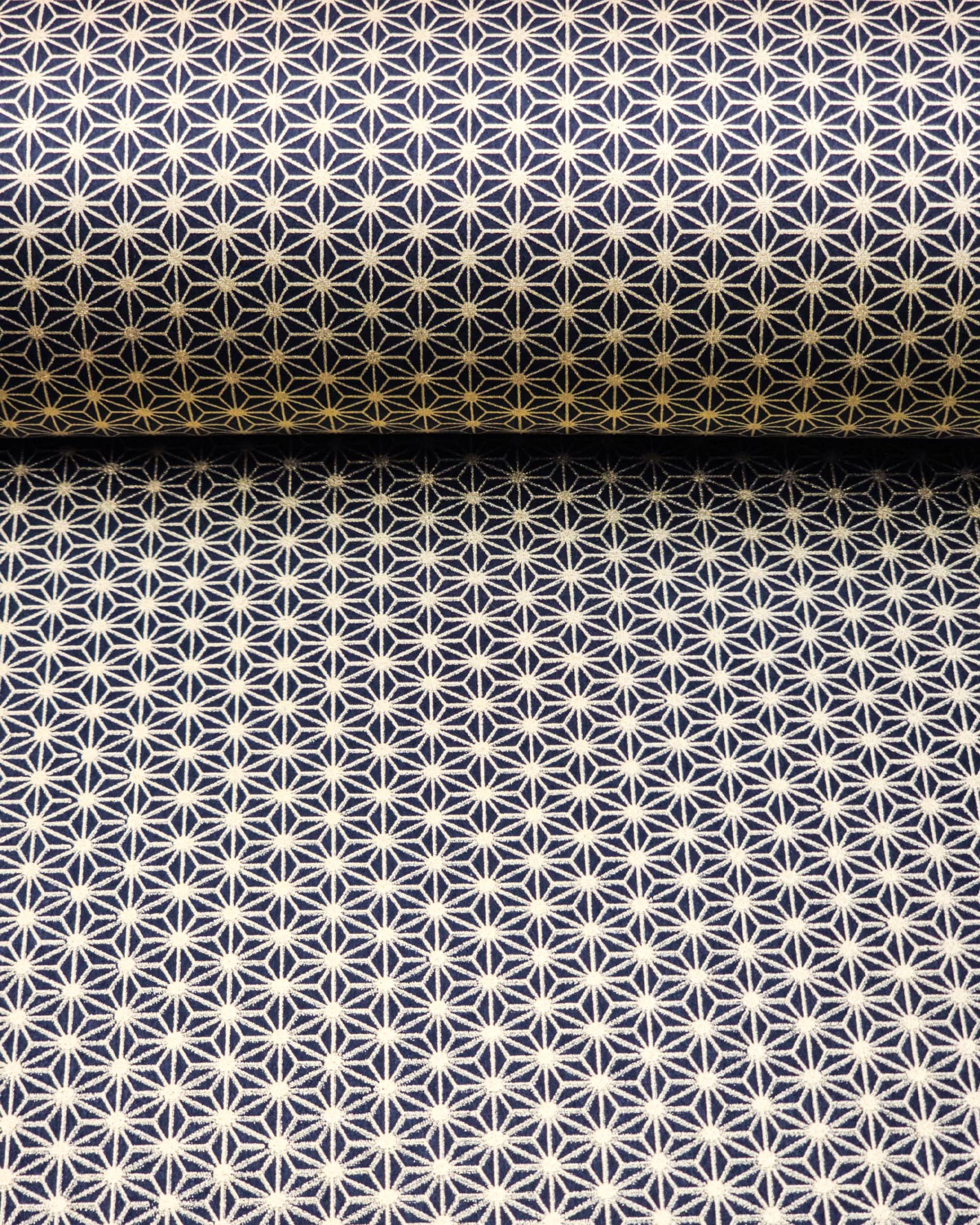 Japanese chiyogami paper featuring a small traditional gold asanoha (hemp leaf) pattern on a black background.