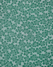 Japanese chiyogami paper featuring white pointillistic cherry blossoms on a dark green background.