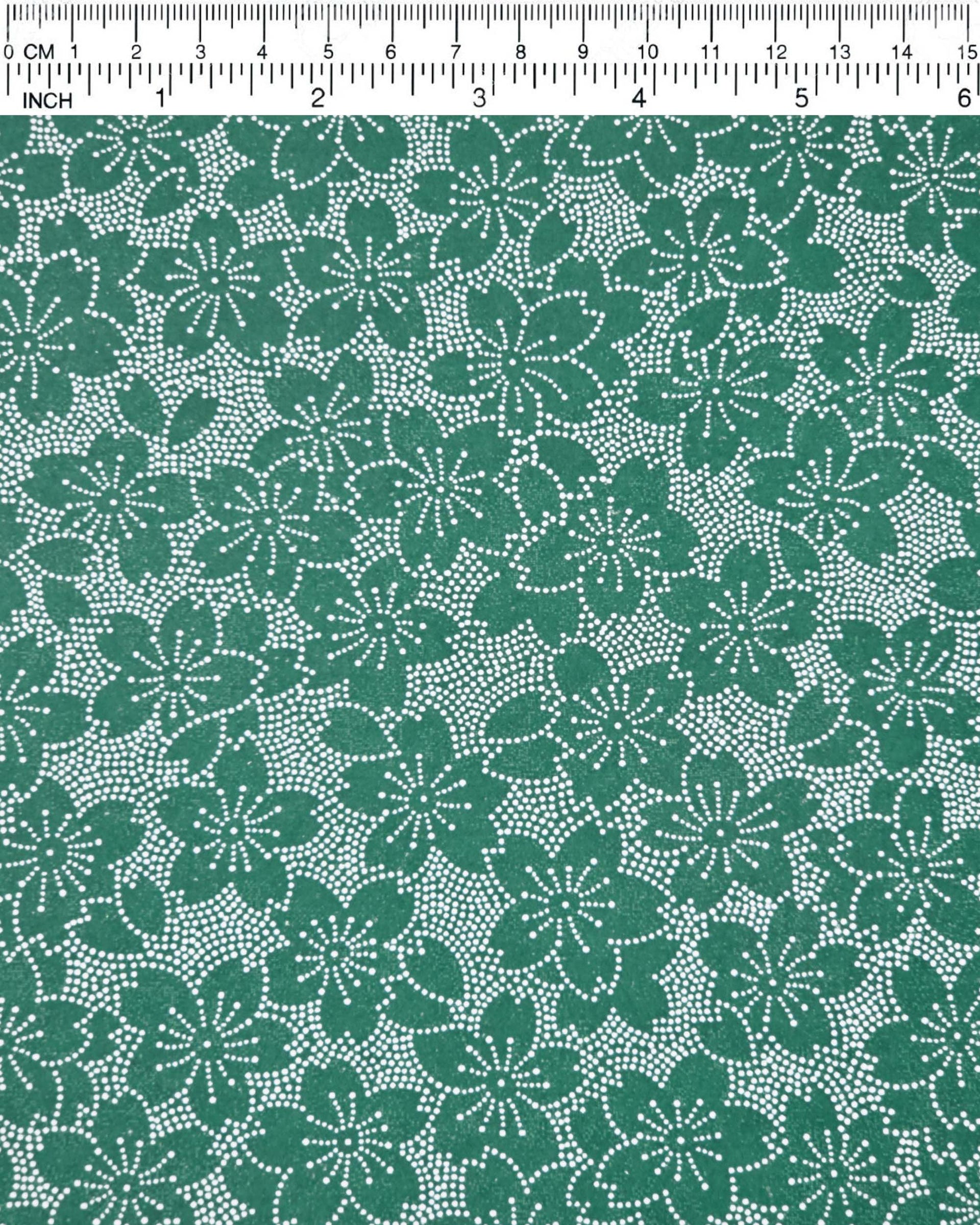 Japanese chiyogami paper featuring white pointillistic cherry blossoms on a dark green background.
