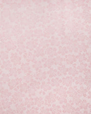 Japanese chiyogami paper featuring white pointillistic cherry blossoms on a dusty blush pink background.