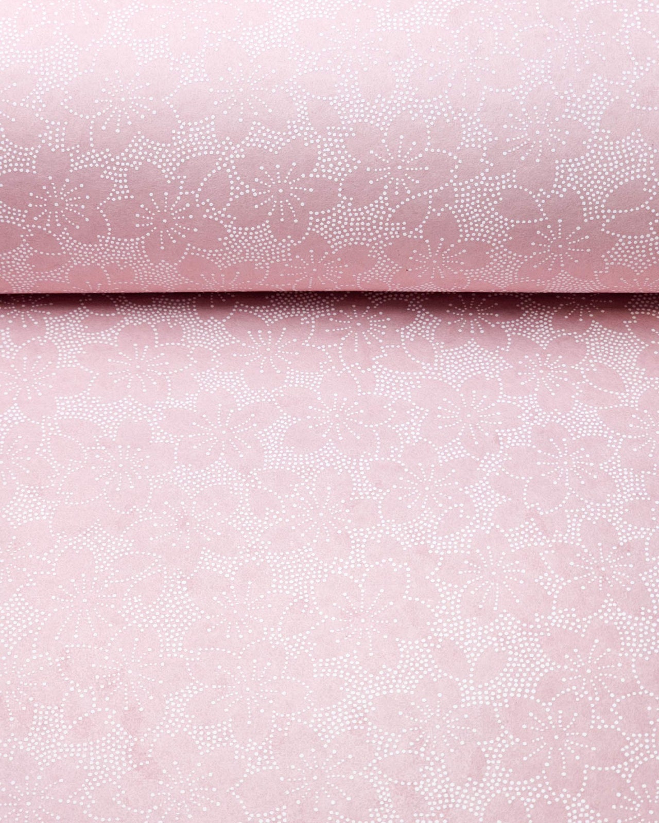 Japanese chiyogami paper featuring white pointillistic cherry blossoms on a dusty blush pink background.