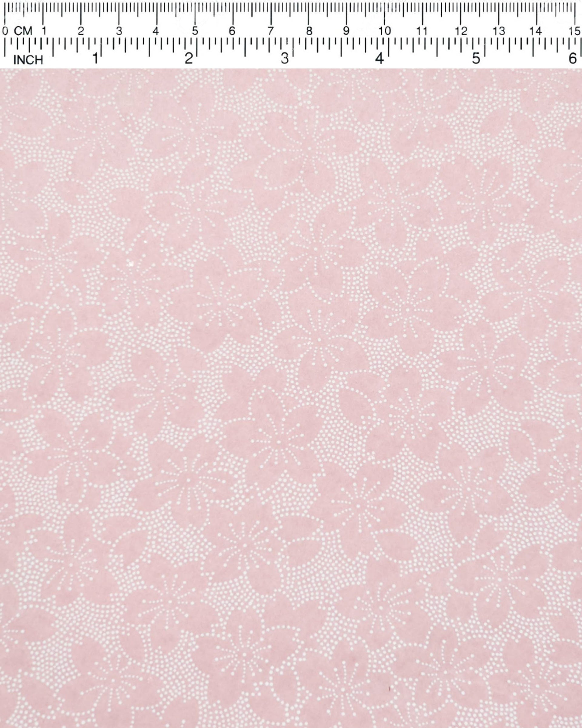 Japanese chiyogami paper featuring white pointillistic cherry blossoms on a dusty blush pink background.