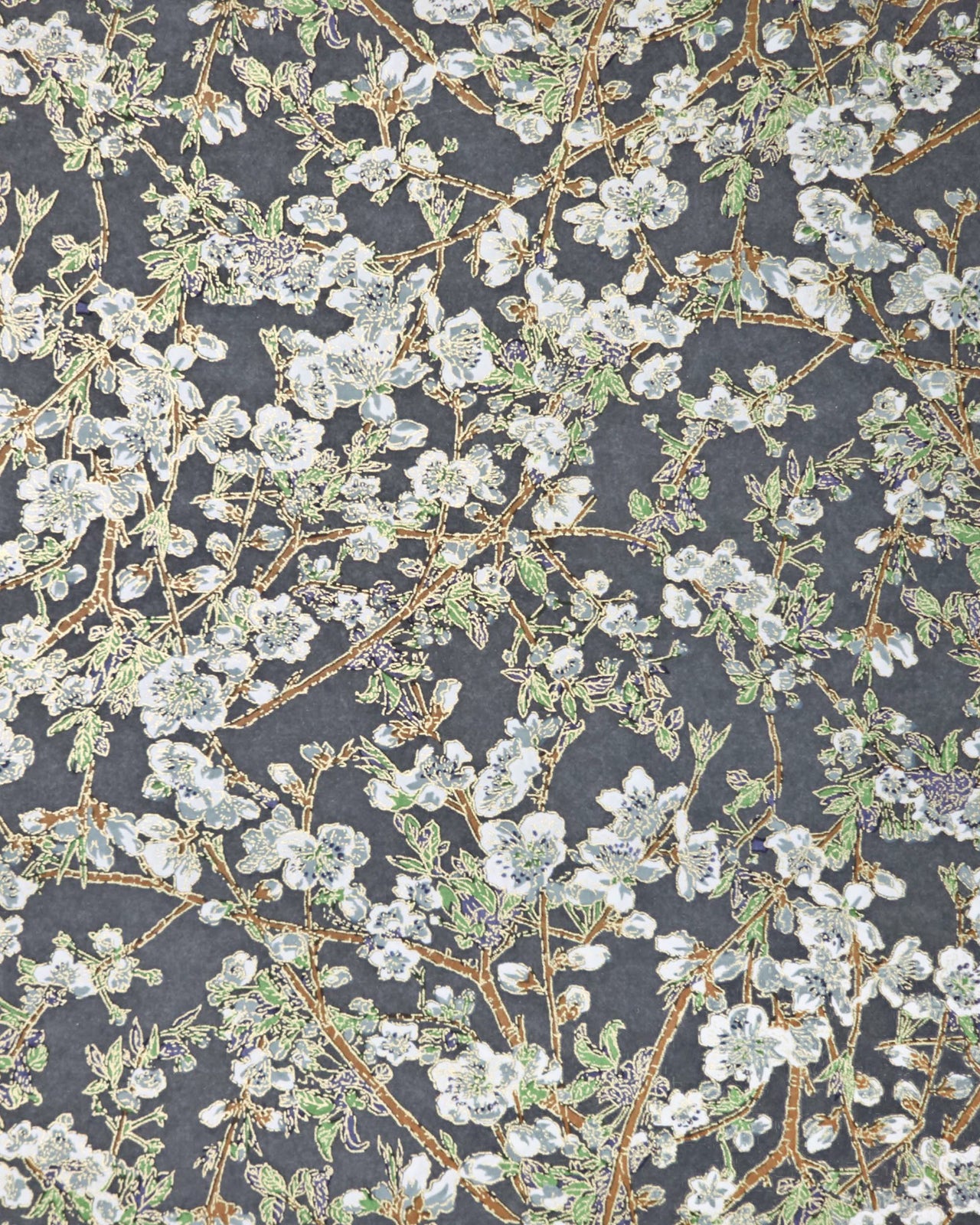 Japanese chiyogami paper featuring gray and white detailed plum blossoms with brown branches and green leaves on a dark gray background with metallic gold details.