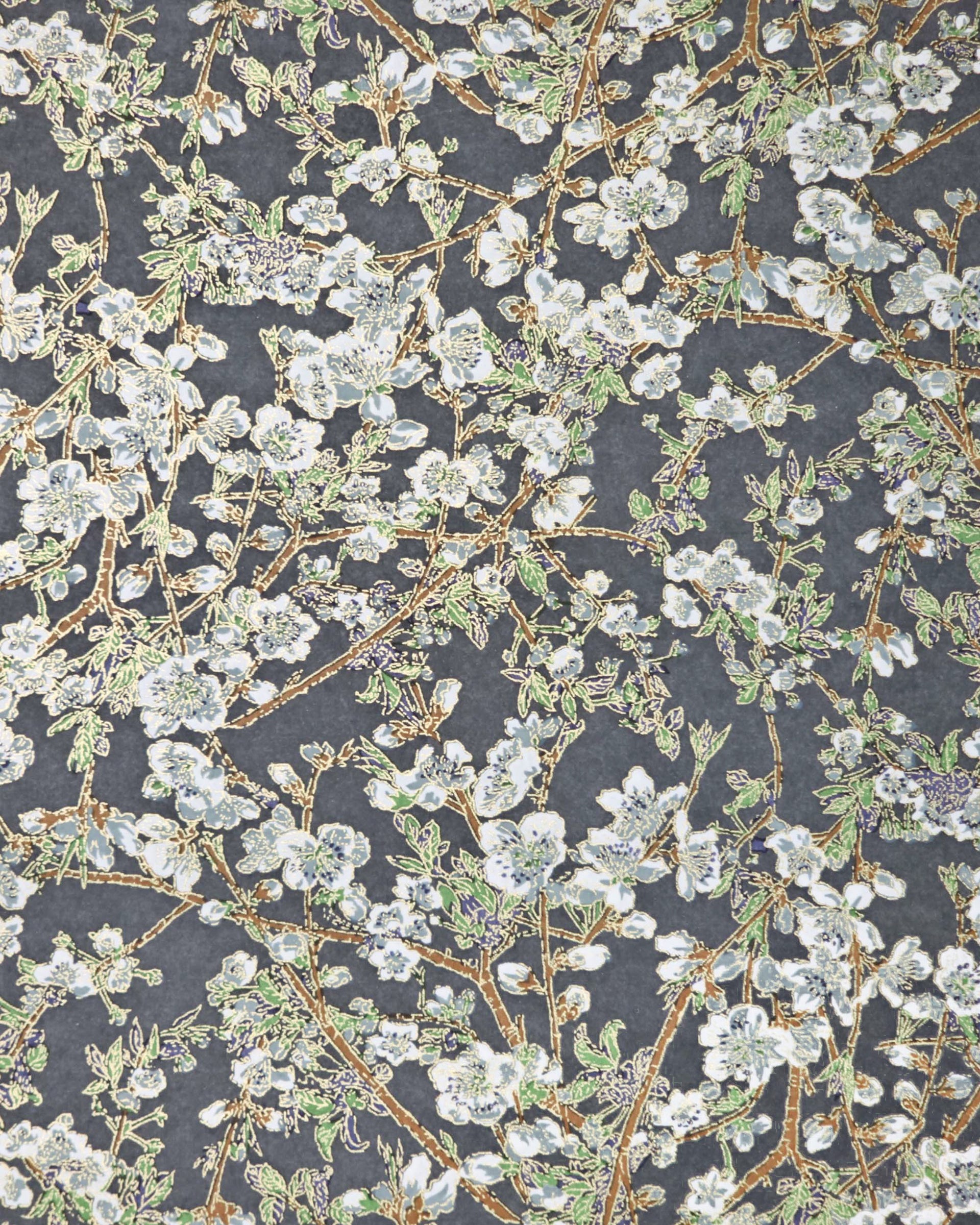 Japanese chiyogami paper featuring gray and white detailed plum blossoms with brown branches and green leaves on a dark gray background with metallic gold details.