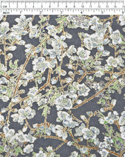 Japanese chiyogami paper featuring gray and white detailed plum blossoms with brown branches and green leaves on a dark gray background with metallic gold details.