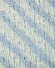 Japanese chiyogami paper featuring black Japanese calligraphy on a vertically swirling blue-gray and cream gradient background with metallic gold details.