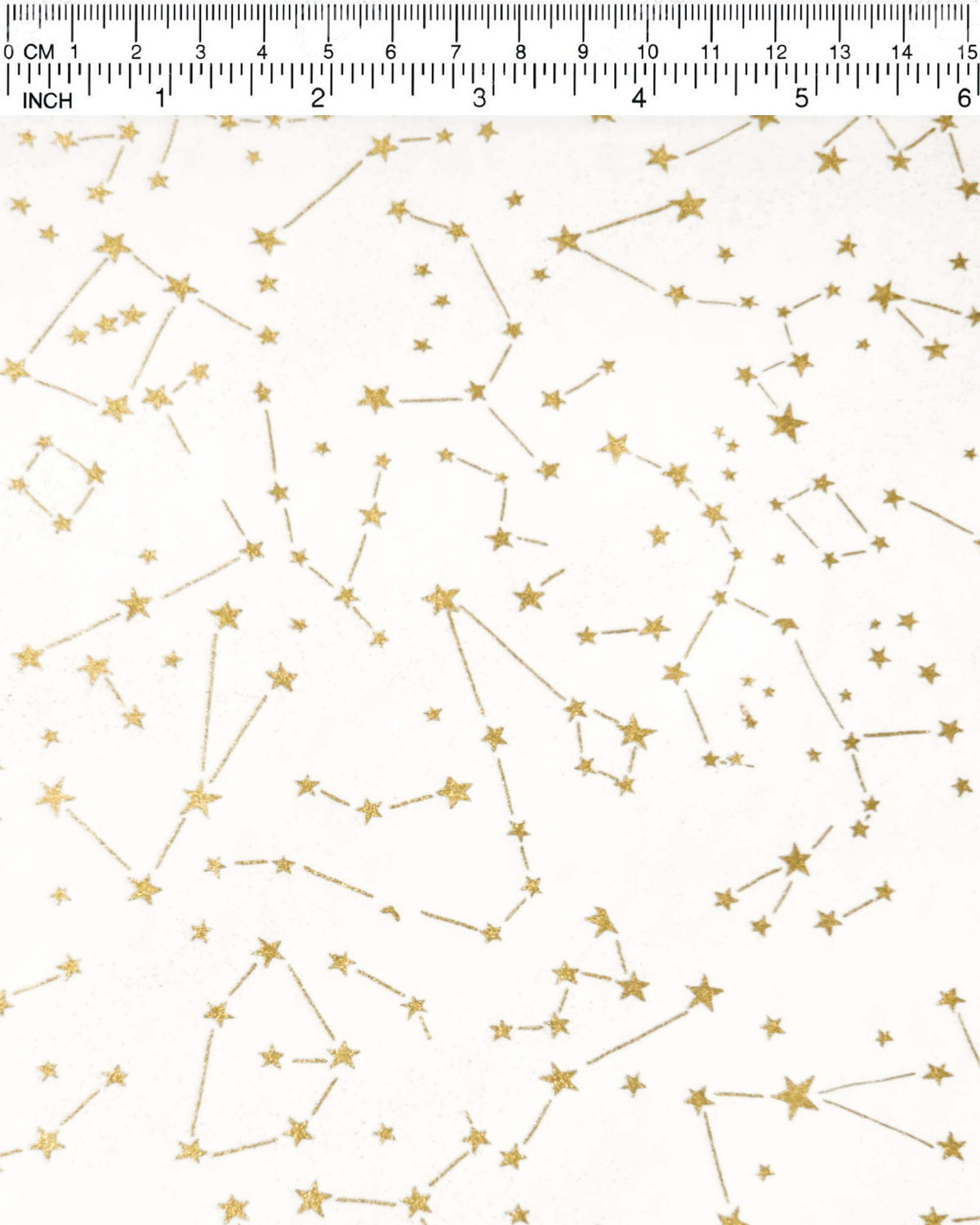Japanese chiyogami paper featuring metallic gold stars and constellations scattered across a white background with shimmering metallic silver stardust, shown next to a ruler for size reference.
