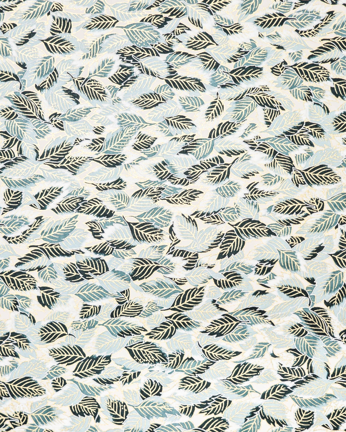 Japanese chiyogami paper featuring dark green, light blue-green, and white leaves on a white background with metallic gold details. 