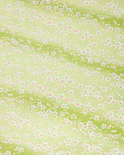 Japanese chiyogami paper featuring small white plum blossom with pink centers and gold matsuba (pine needles) on a green gradient background with metallic gold details. 