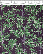 Japanese chiyogami paper featuring bamboo stalks outlined in gray with dark and light green bamboo leaves on a black background, shown next to a ruler for size reference.
