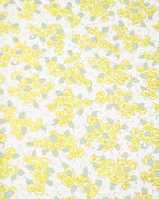 Japanese chiyogami paper featuring yellow and white roses with light green leaves and smaller white flowers on a white background with metallic gold details. 