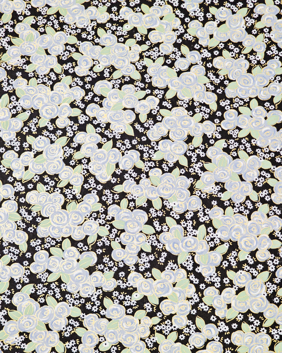 Japanese chiyogami paper featuring blue and white roses with light green leaves and smaller white flowers on a black background with metallic gold details. 