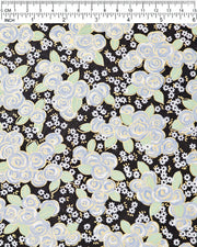 Japanese chiyogami paper featuring blue and white roses with light green leaves and smaller white flowers on a black background with metallic gold details, shown next to a ruler for size reference.