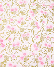 Japanese chiyogami paper featuring pink cherry blossoms alongside gold cherry blossoms and leaves decorated with a traditional kanoko (fawn) pattern on a light pink background. 