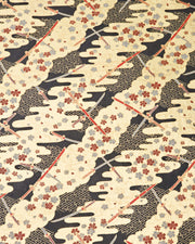 Japanese chiyogami paper featuring red and gray katana swords with gray and maroon red cherry blossoms on a black and gold background with metallic gold details. 