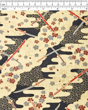 Japanese chiyogami paper featuring red and gray katana swords with gray and maroon red cherry blossoms on a black and gold background with metallic gold details, shown next to a ruler for size reference.

