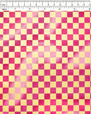 Japanese chiyogami paper featuring a large metallic gold traditional ichimatsu (checker) pattern on a flowing background in various shades of magenta pink, shown next to a ruler for size reference.