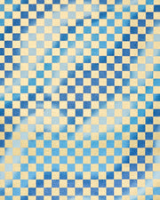 Japanese chiyogami paper featuring a large metallic gold traditional ichimatsu (checker) pattern on a flowing background in various shades of blue. 