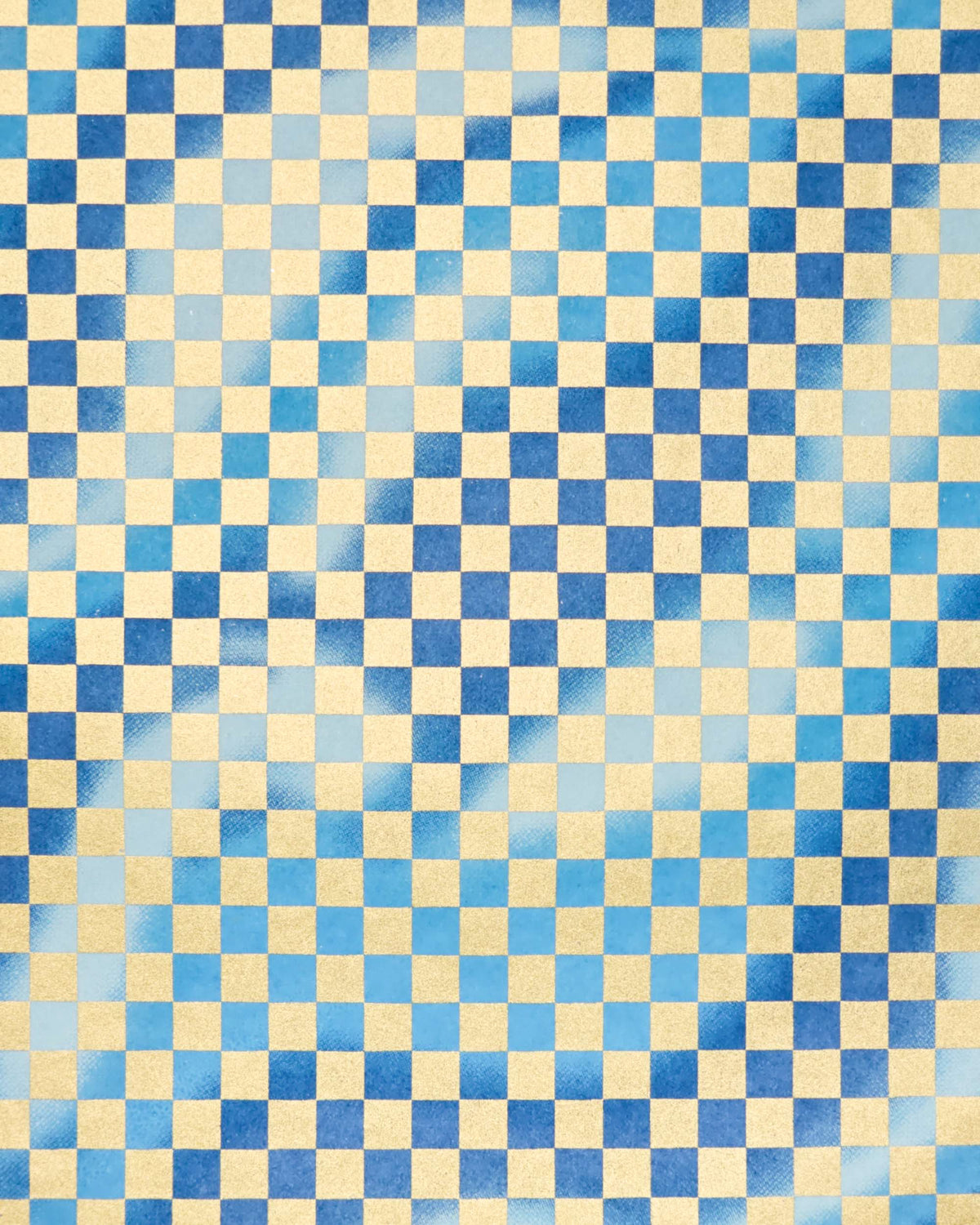 Japanese chiyogami paper featuring a large metallic gold traditional ichimatsu (checker) pattern on a flowing background in various shades of blue. 