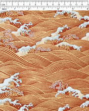 Japanese chiyogami paper featuring metallic gold waves with beige and white detailed waves on a red background, shown next to a ruler for size reference.