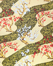 Japanese chiyogami paper featuring red and white plum and cherry blossom trees set against a metallic gold and black water ripple pattern on a gold background. 