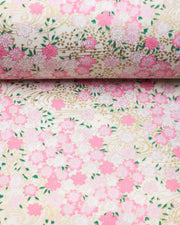 Japanese chiyogami paper featuring light pink cherry blossoms a light cream background with metallic gold details.