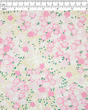 Japanese chiyogami paper featuring light pink cherry blossoms a light cream background with metallic gold details.
