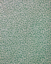 Japanese chiyogami paper featuring metallic gold traditional karakusa design on a green background with silver glitter.