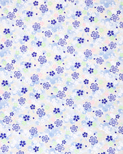 Japanese chiyogami paper featuring blue, white, green, and pink cherry blossoms on a light blue background with metallic gold details.