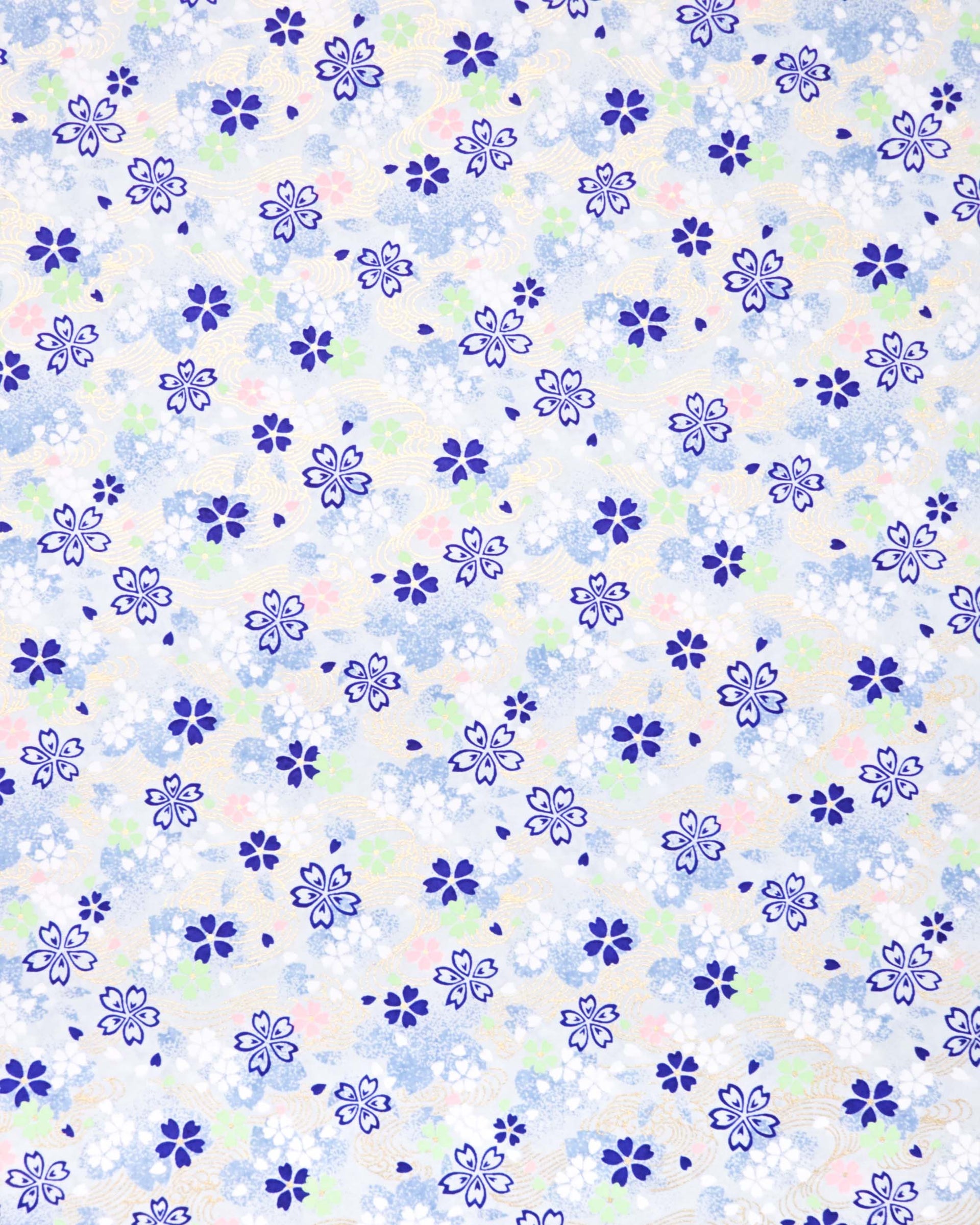 Japanese chiyogami paper featuring blue, white, green, and pink cherry blossoms on a light blue background with metallic gold details.