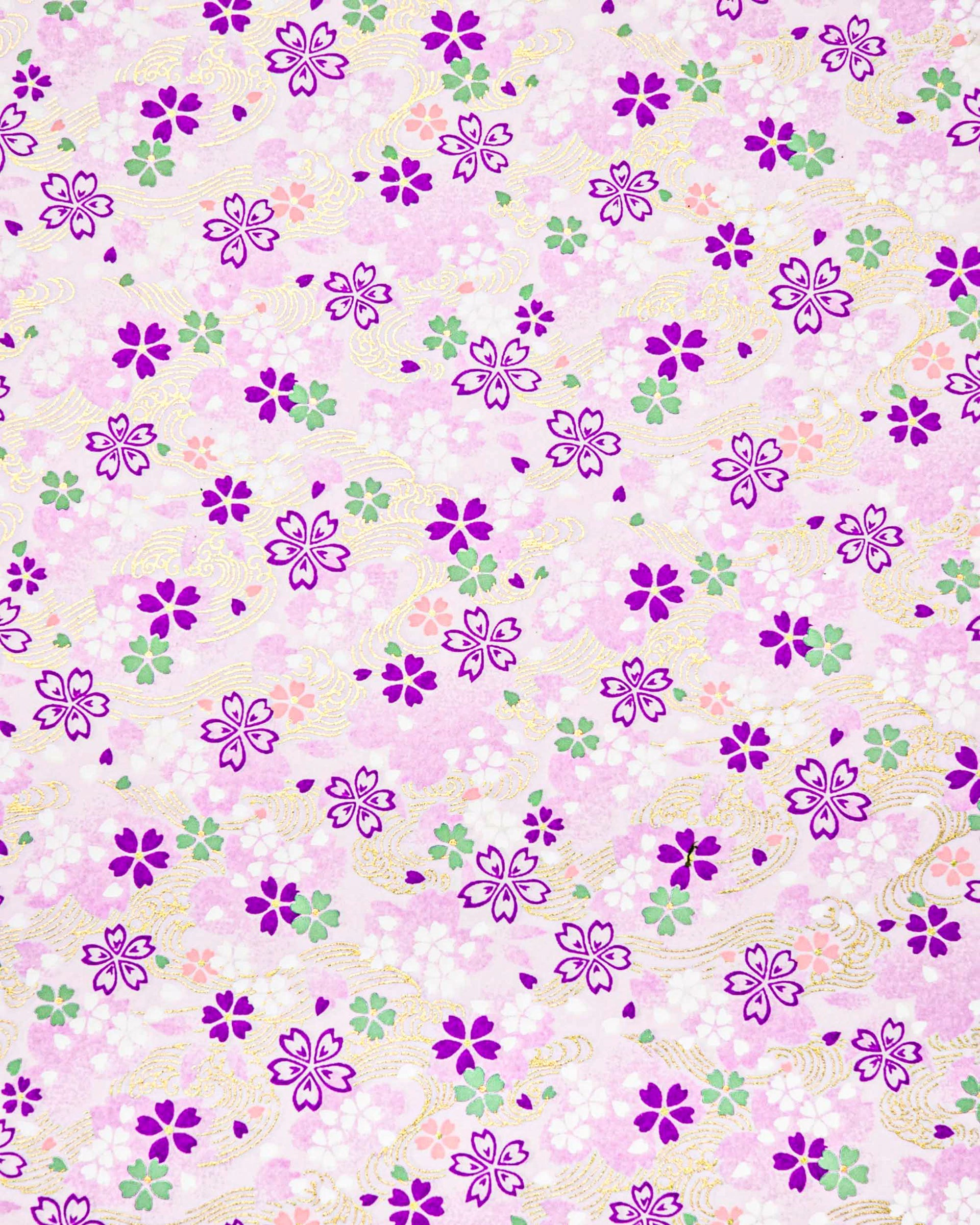Japanese chiyogami paper featuring purple, white, green, and pink cherry blossoms on a purple background with metallic gold details.