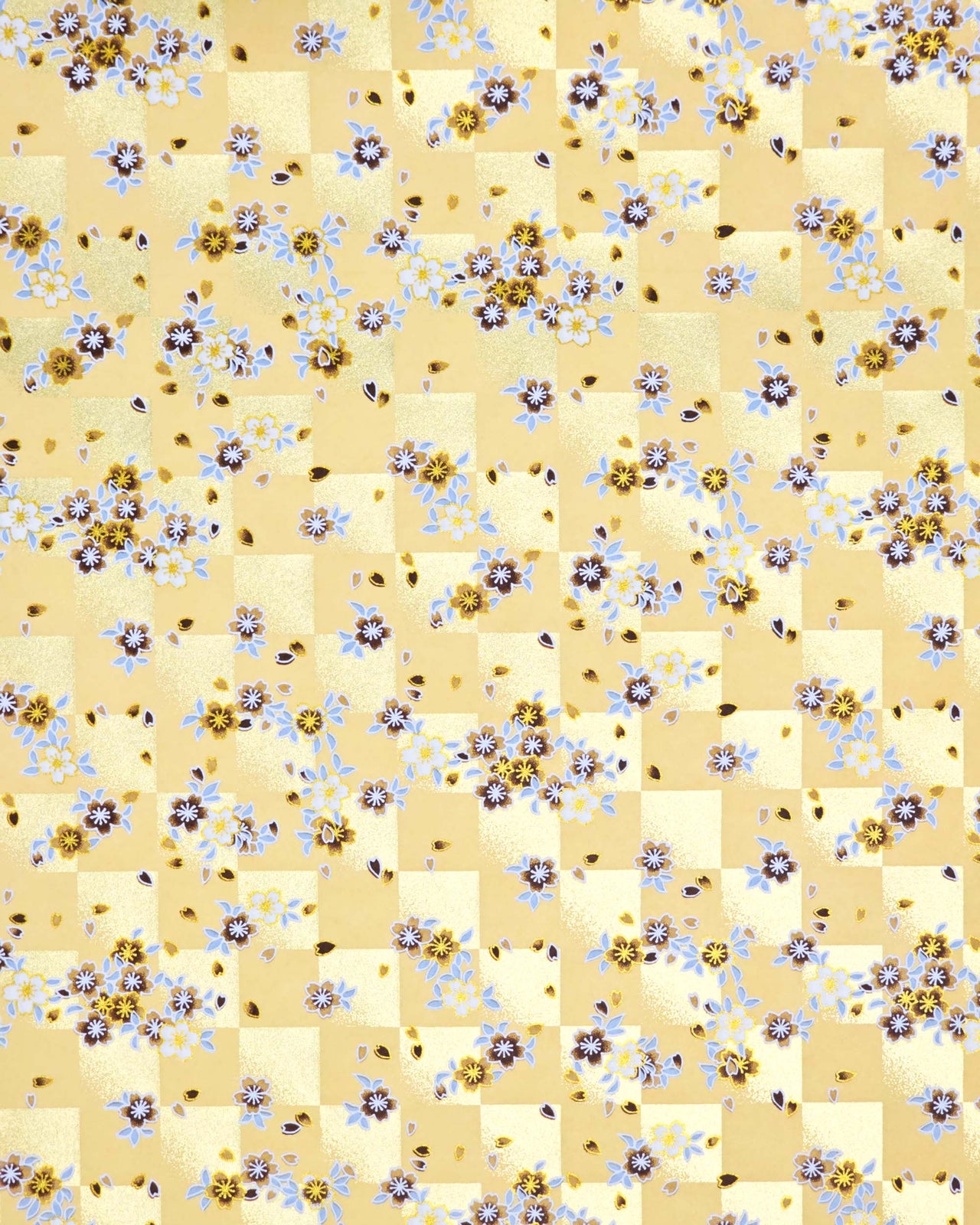 Japanese chiyogami paper featuring brown and white cherry blossoms on a caramel brown and gold ichimatsu (checker) background with metallic gold details.