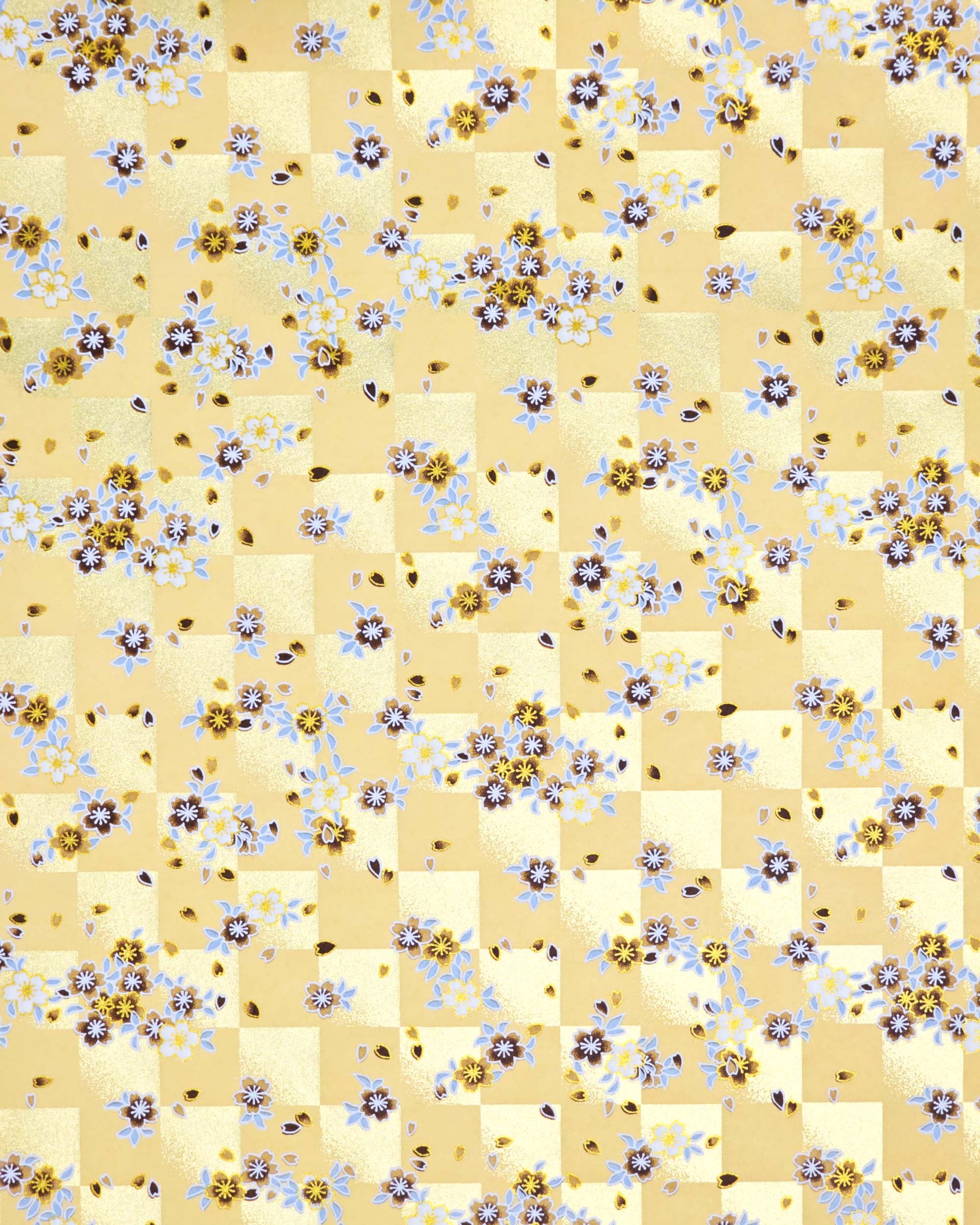 Japanese chiyogami paper featuring brown and white cherry blossoms on a caramel brown and gold ichimatsu (checker) background with metallic gold details.