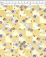 Japanese chiyogami paper featuring brown and white cherry blossoms on a caramel brown and gold ichimatsu (checker) background with metallic gold details.