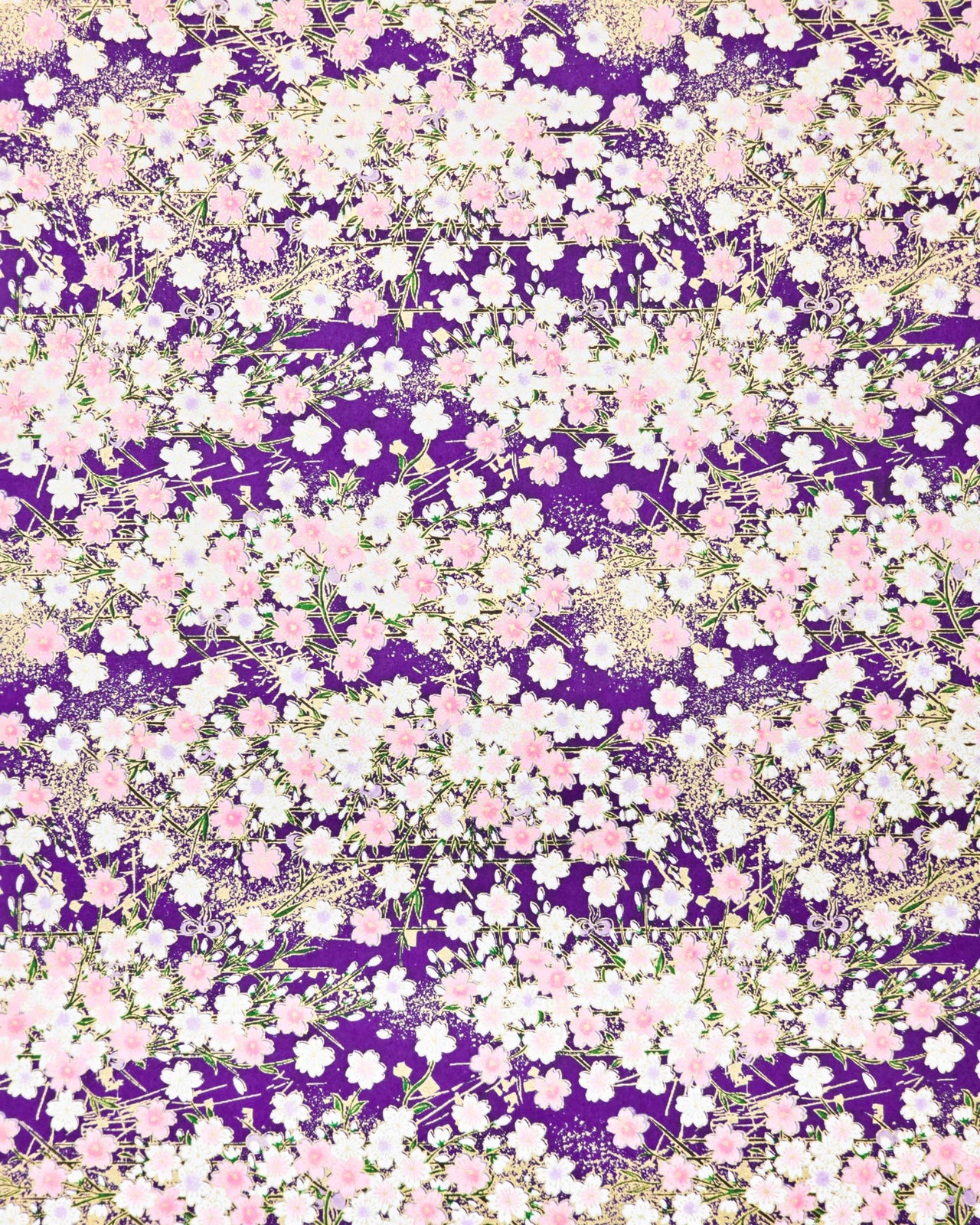 Japanese chiyogami paper featuring light pink and white cherry blossoms on a dark purple background with metallic gold details.