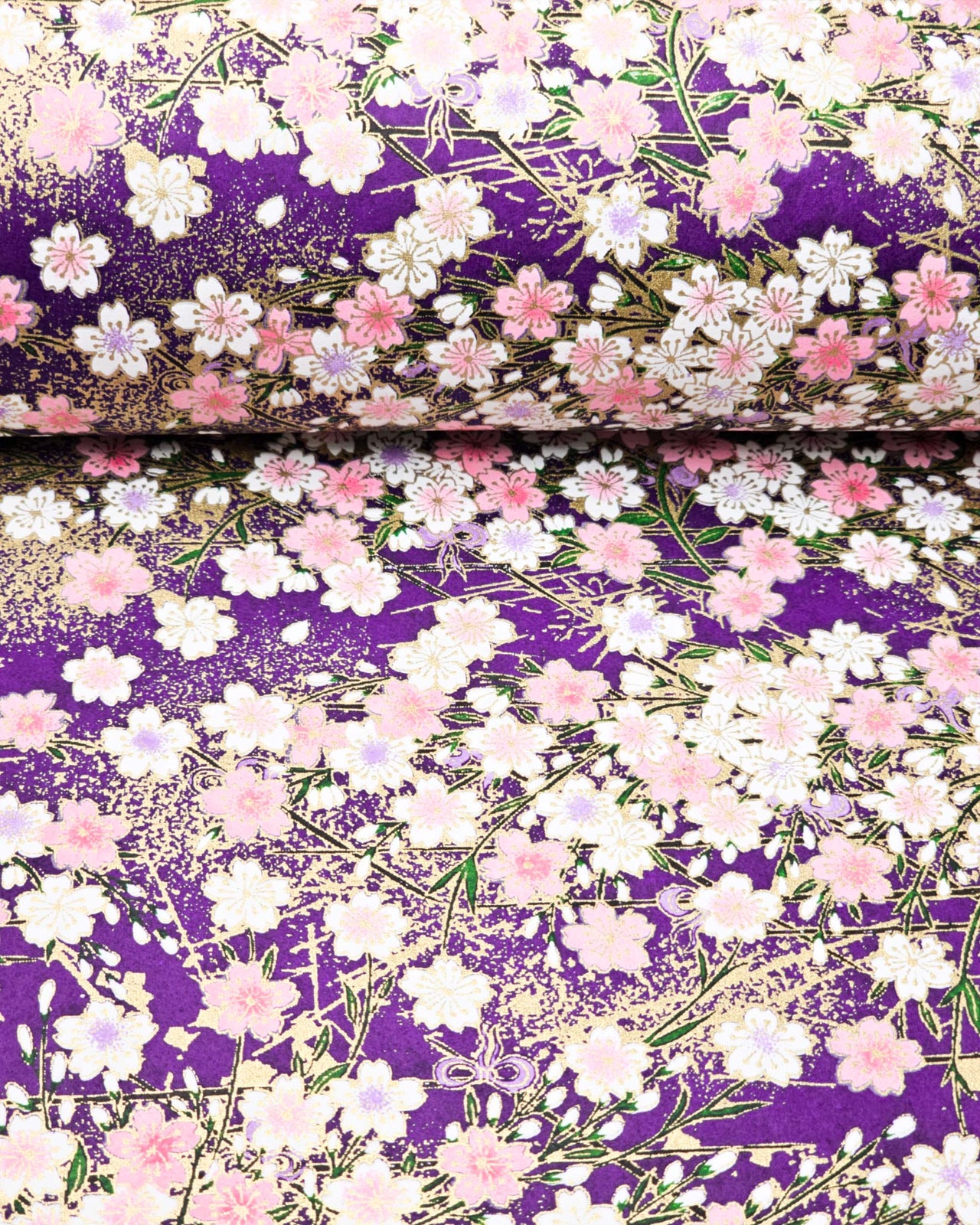 Japanese chiyogami paper featuring light pink and white cherry blossoms on a dark purple background with metallic gold details.