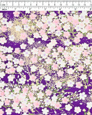 Japanese chiyogami paper featuring light pink and white cherry blossoms on a dark purple background with metallic gold details.
