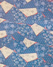 Japanese chiyogami paper featuring blue, beige, and red patches with floral and traditional Japanese patterns with metallic gold details.