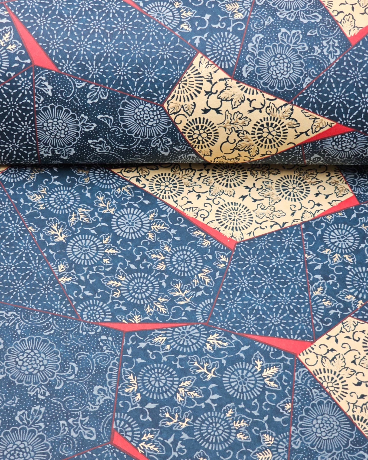 Japanese chiyogami paper featuring blue, beige, and red patches with floral and traditional Japanese patterns with metallic gold details.