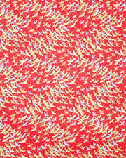 Japanese chiyogami paper featuring small white and metallic gold flying cranes in a zigzag formation on a red background.