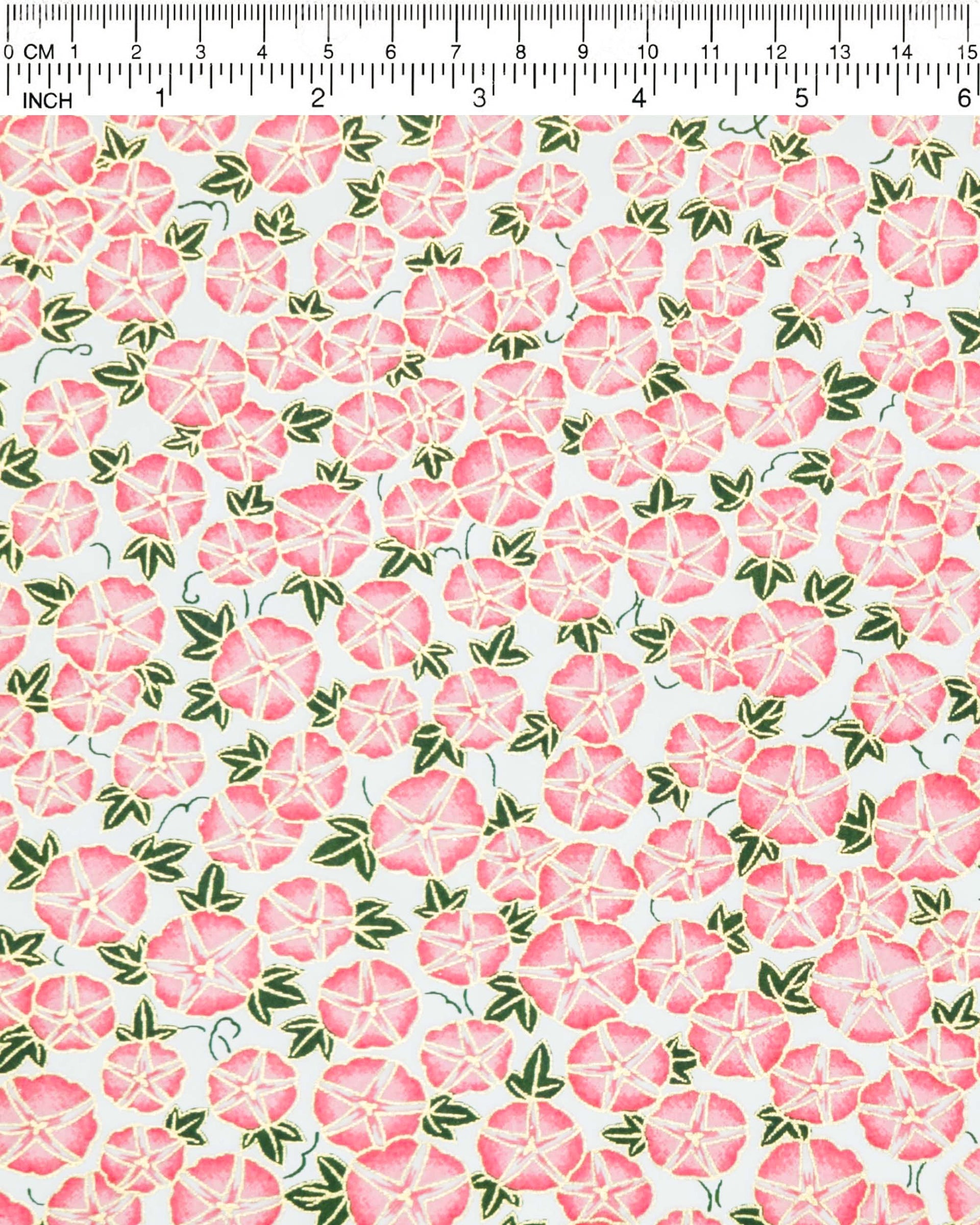 Japanese chiyogami paper featuring pink morning glory flowers with green leaves on a white background with metallic gold details.