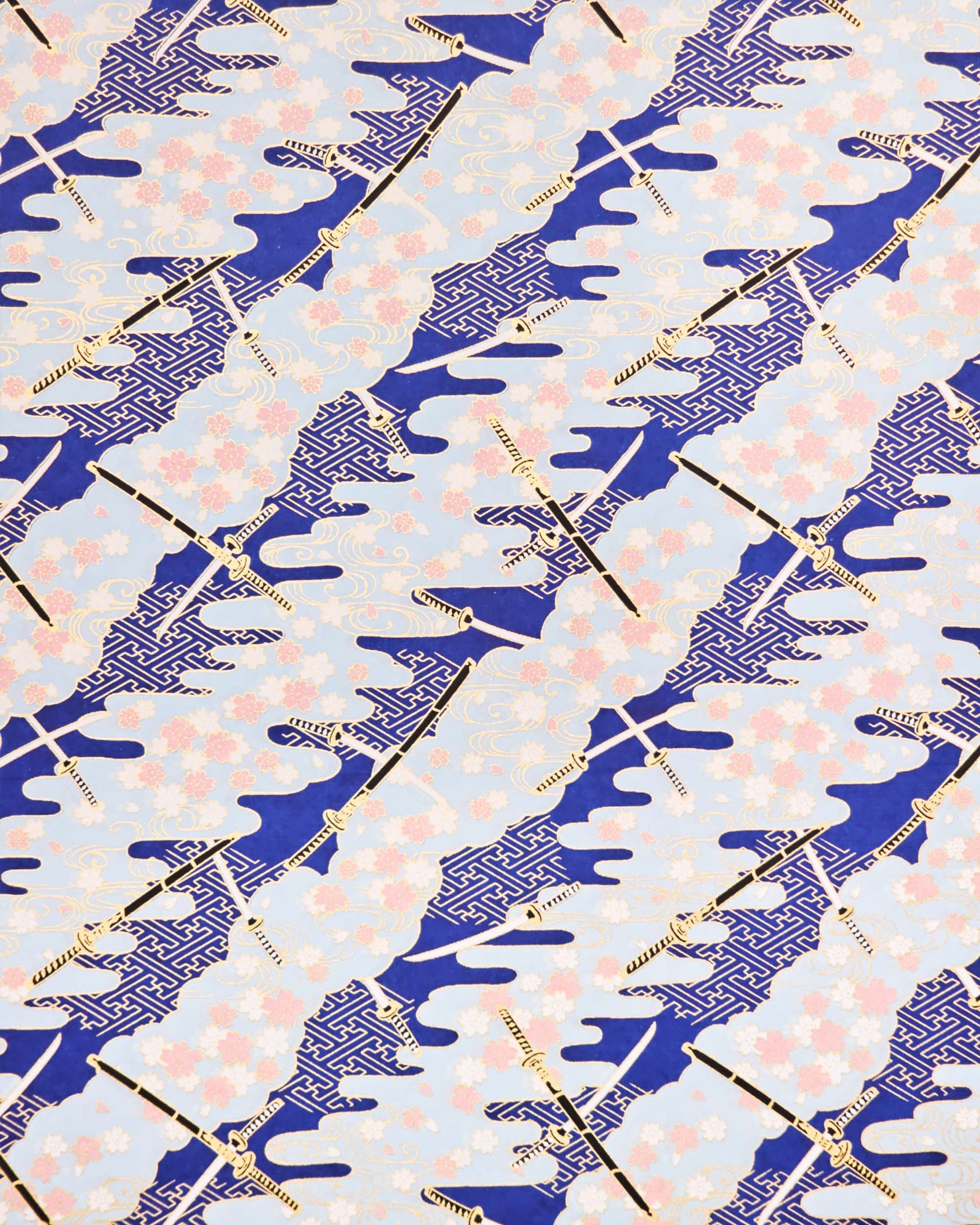 Japanese chiyogami paper featuring black and white katana swords with white and light pink cherry blossoms on a blue background with metallic gold details.